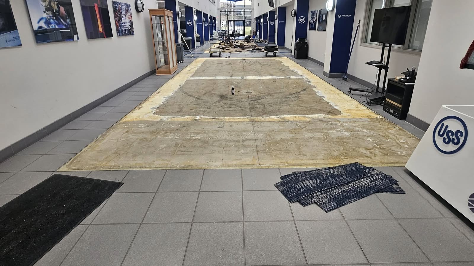 Atrium corridor during tear-out, old floor removed to the slab