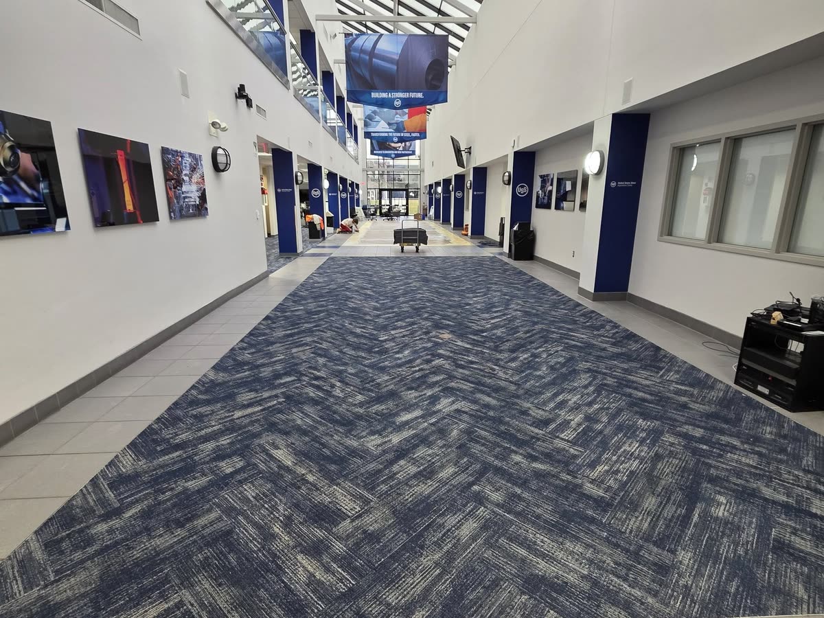 Herringbone carpet plank in a two-story atrium